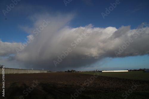 stratocumulus clouds with rain showers above the Zuidplaspolder in Zevenhuizen the Netherlands