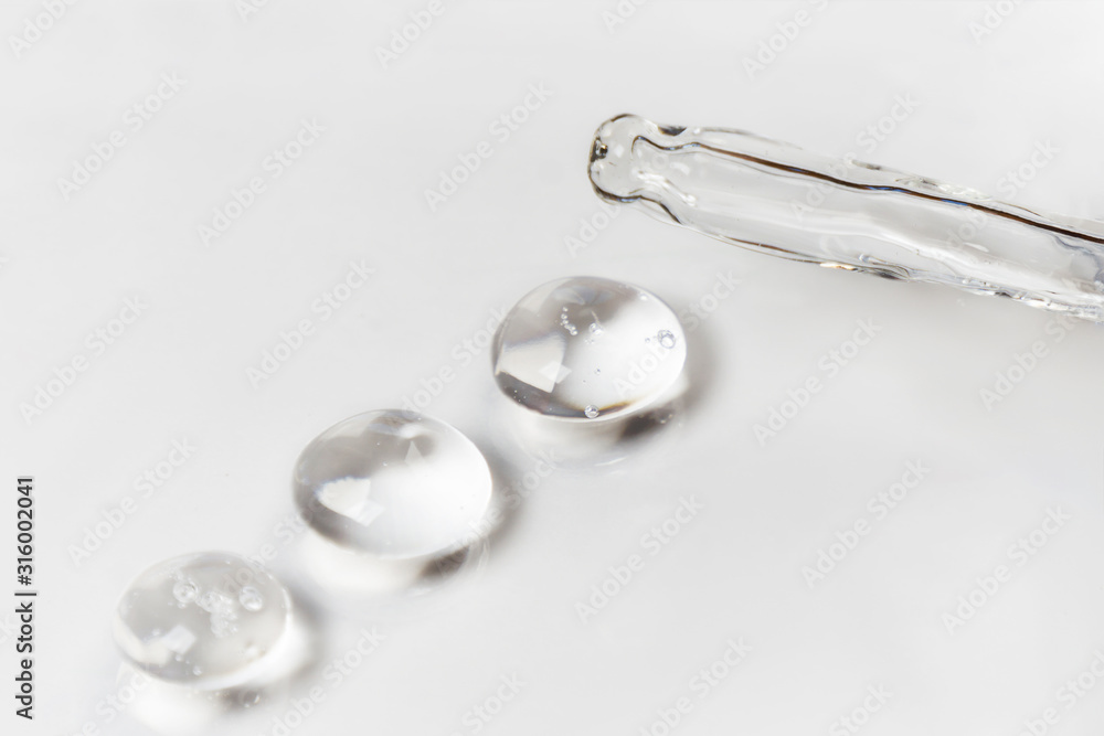 Drops of hyaluron on a white background medical concept Oxygen filled fluid Drops of hyaluron on a white background medical concept Oxygen filled fluid