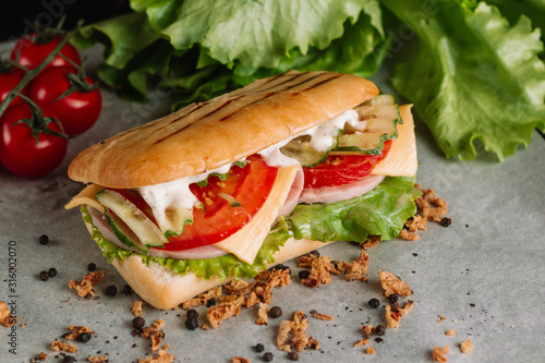 Sandwich fresh pita bread beef falafel RecipeTin Eatsfilled with grilled meat, mushrooms, cheese. Traditional Middle Eastern snack. On peper background. photo