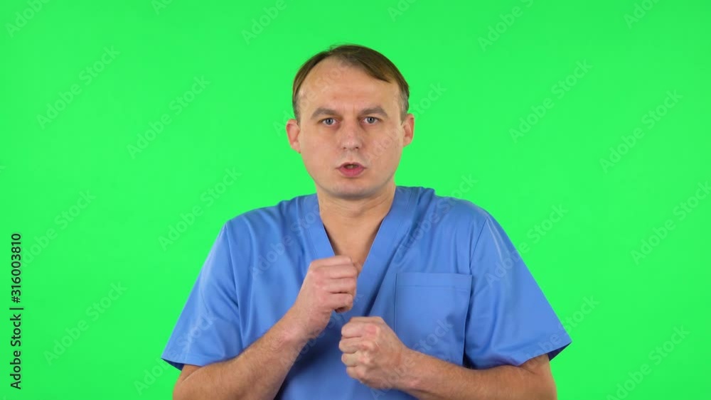 Medical man is very frightened, then sighs in relief. Green screen Medical man is very frightened, then sighs in relief. Green screen