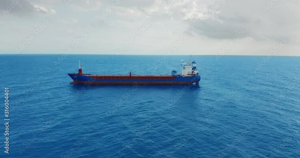 Freight ship floating on sea. Aerial view. Freight ship floating on sea. Aerial view.