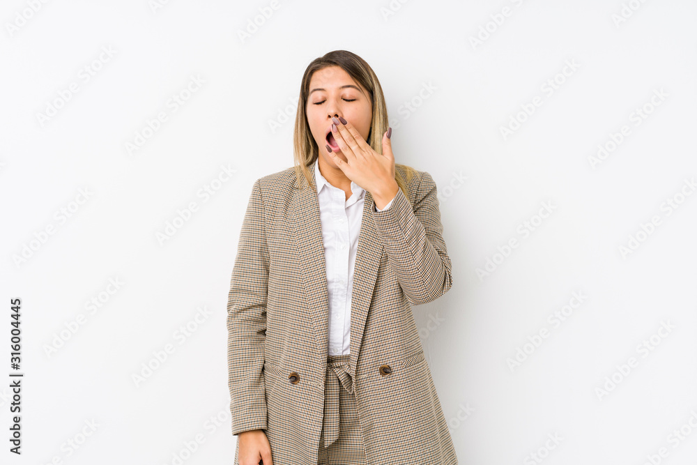 Young caucasian business woman isolated yawning showing a tired gesture covering mouth with hand. Young caucasian business woman isolated yawning showing a tired gesture covering mouth with hand.