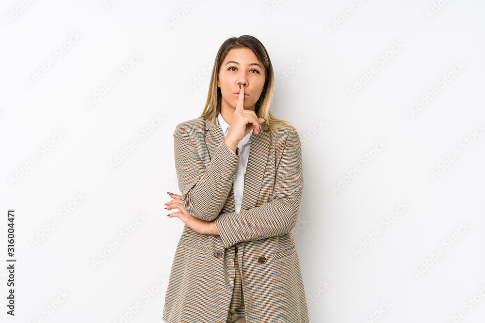Young caucasian business woman isolated keeping a secret or asking for silence. Young caucasian business woman isolated keeping a secret or asking for silence.