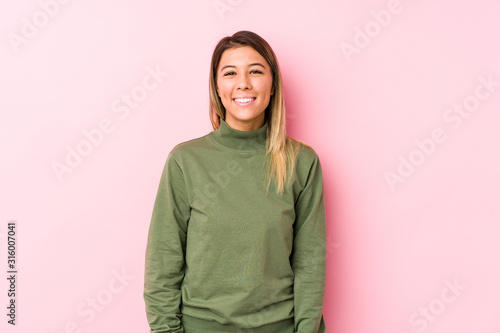 Young caucasian woman posing isolated  happy, smiling and cheerful. © Asier