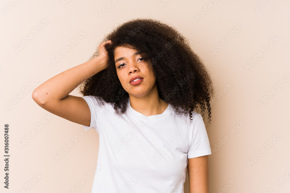 Young african american woman tired and very sleepy keeping hand on head. Young african american woman tired and very sleepy keeping hand on head.