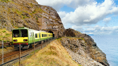 Closeup of train exiting a tunnel. View from Cliff Walk Bray to Greystones, Ireland photo