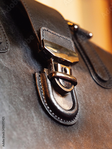 business leather handbag in black with a closeup of the castle