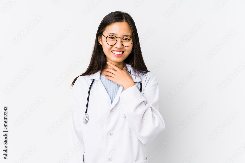 Young doctor chinese woman isolated laughs out loudly keeping hand on chest. Young doctor chinese woman isolated laughs out loudly keeping hand on chest.