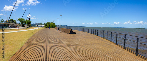 Panorama with walkpath, buildings and lake at Guaiba shore photo