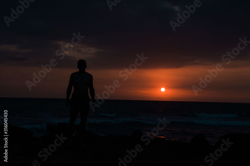 silhouette of man at sunset