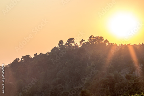 abstract background of nature a high angle that can see the scenery around  trees meadows mountains  the light of the twilight in the evening  and the wind blowing through the large mountains