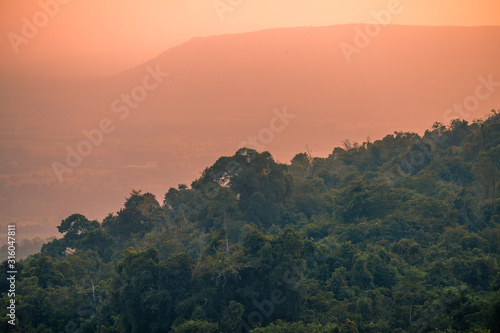 abstract background of nature a high angle that can see the scenery around  trees meadows mountains  the light of the twilight in the evening  and the wind blowing through the large mountains