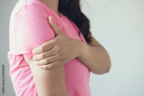 Wallpaper Mural Woman have neck pain, shoulder pain in the  room. Torontodigital.ca