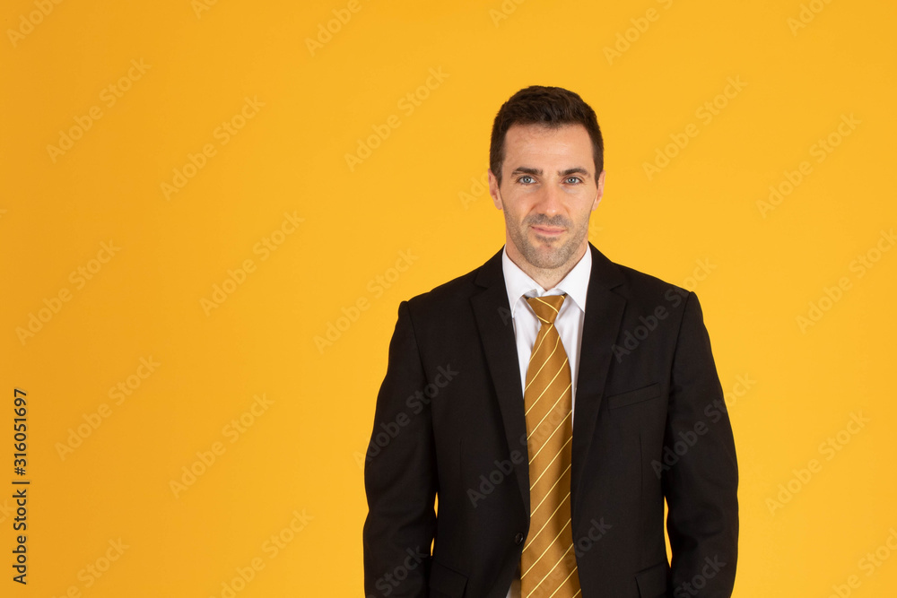 Portrait of confident businessman on yellow background. Portrait of confident businessman on yellow background.