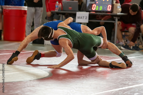 High School wrestlers competing at a wrestling meet