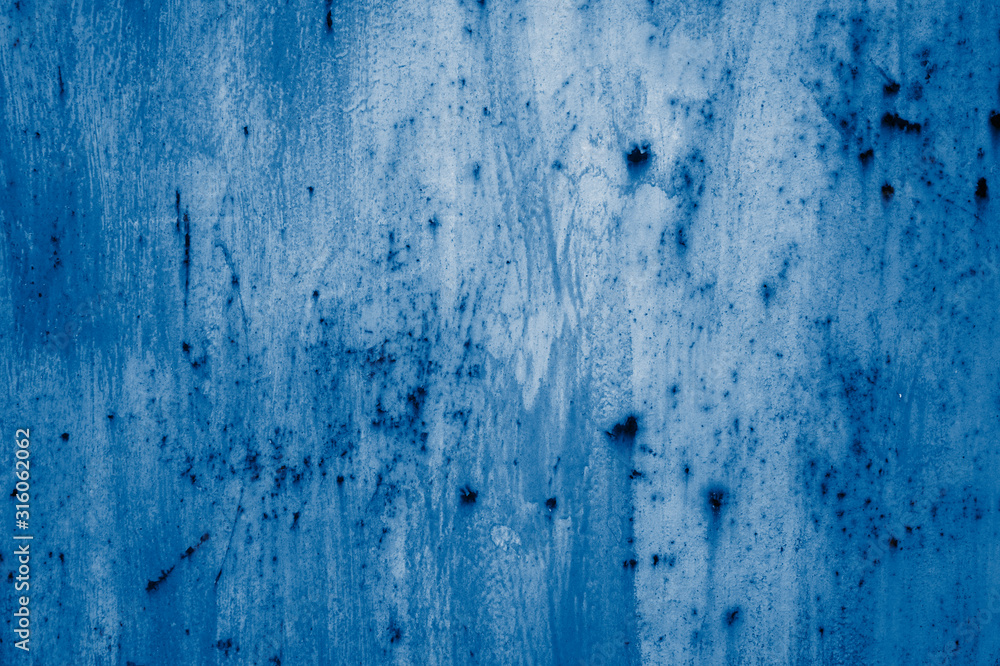 Obraz premium Multicolored peeling wall texture and background. Surface with brush strokes, stains. The colors like used by the Impressionists. toned in classic blue trendy color of the year 2020