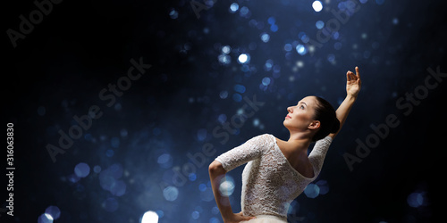 Ballet dancer in jump . Mix...