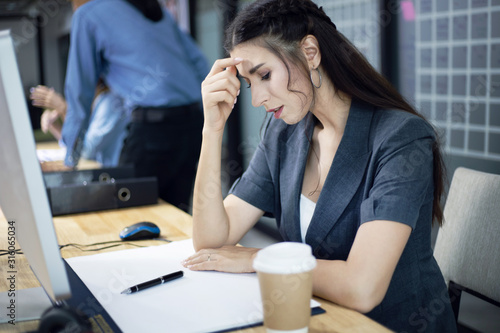Business woman sadness and thinking the problem in the office.