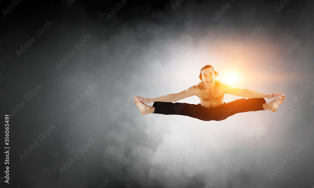 Fototapeta premium Dancer guy in jump. Mixed media