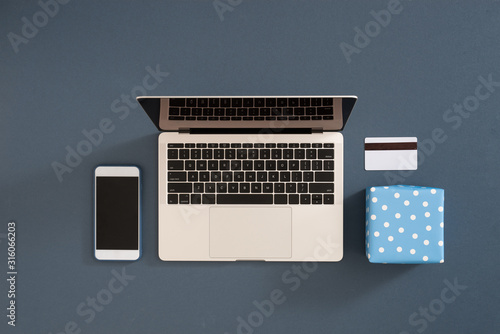 Flat lay minimalist composition for gift wrapping and internet shopping on color background