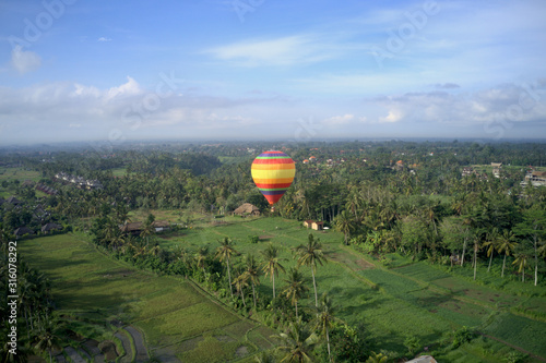 Colorful baloon in Ubud sky during sunrise, Bali