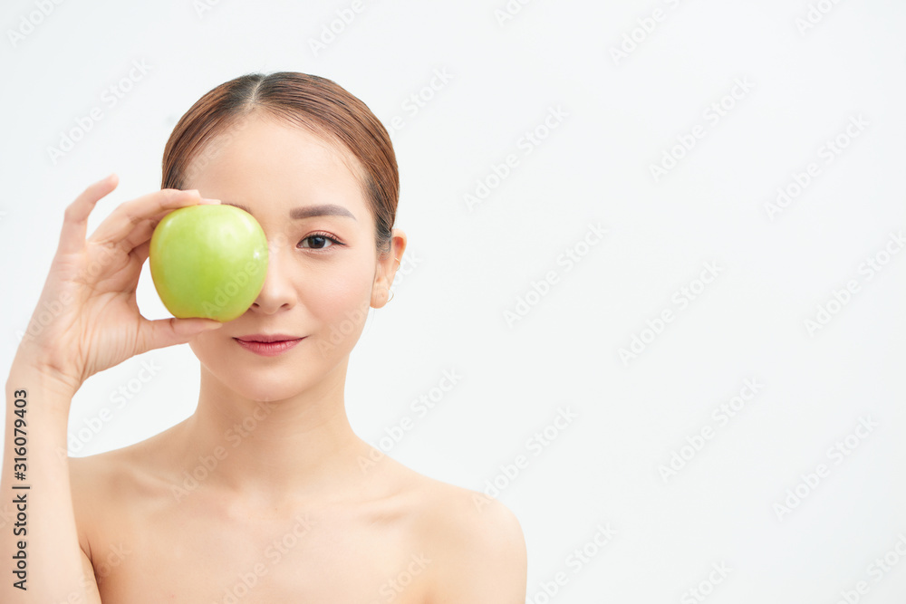 Close up half naked woman 20s perfect skin nude make up hold apple isolated on white background studio portrait. Close up half naked woman 20s perfect skin nude make up hold apple isolated on white background studio portrait.