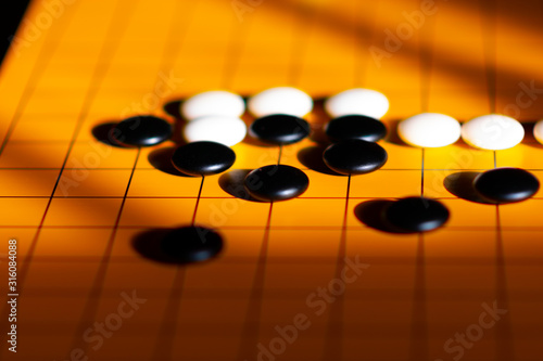 Game of GO in sunlight and shade