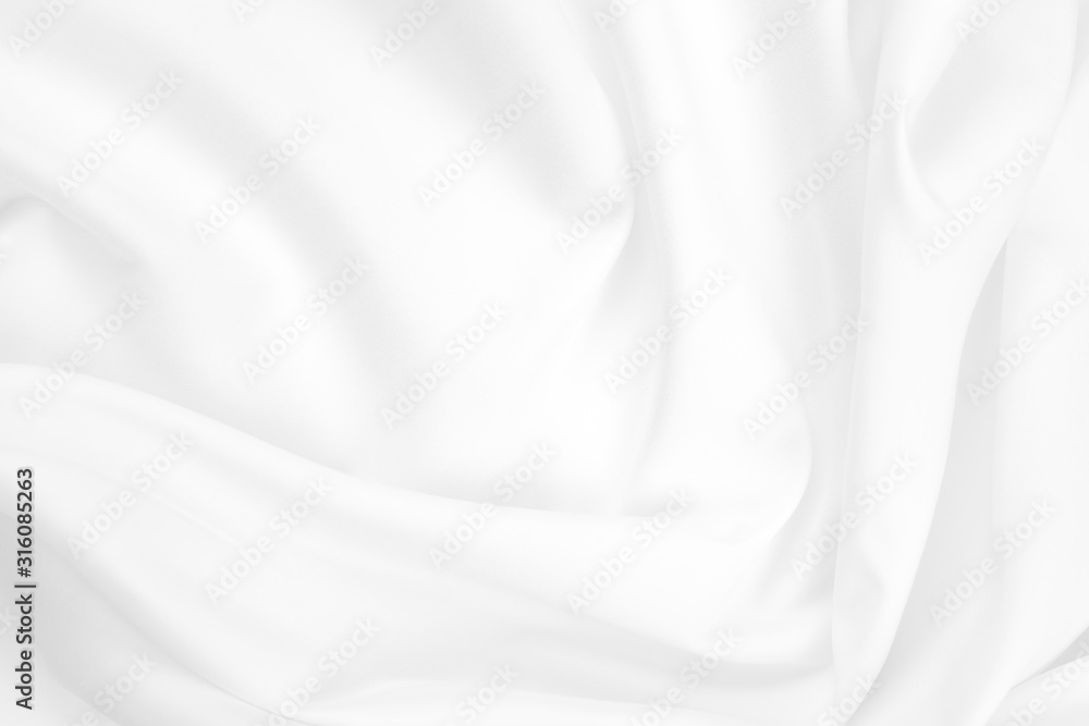 Abstract white fabric texture background. Cloth soft wave. Creases of satin, silk, and cotton.	