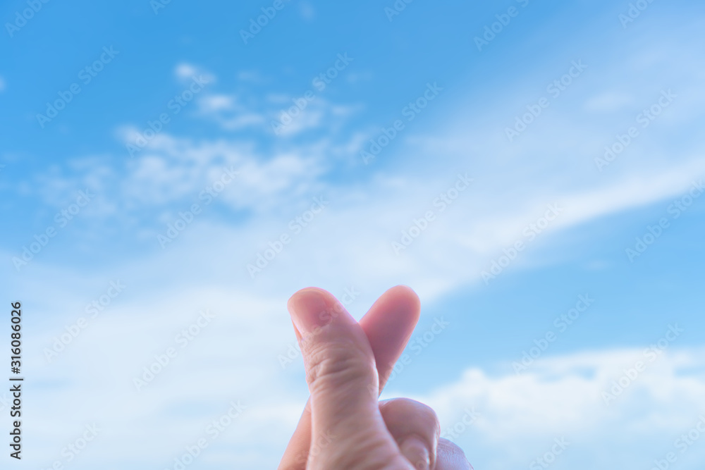 Love symbol of korean with your fingers. A female hand depicts a heart. Love symbol of korean with your fingers. A female hand depicts a heart.