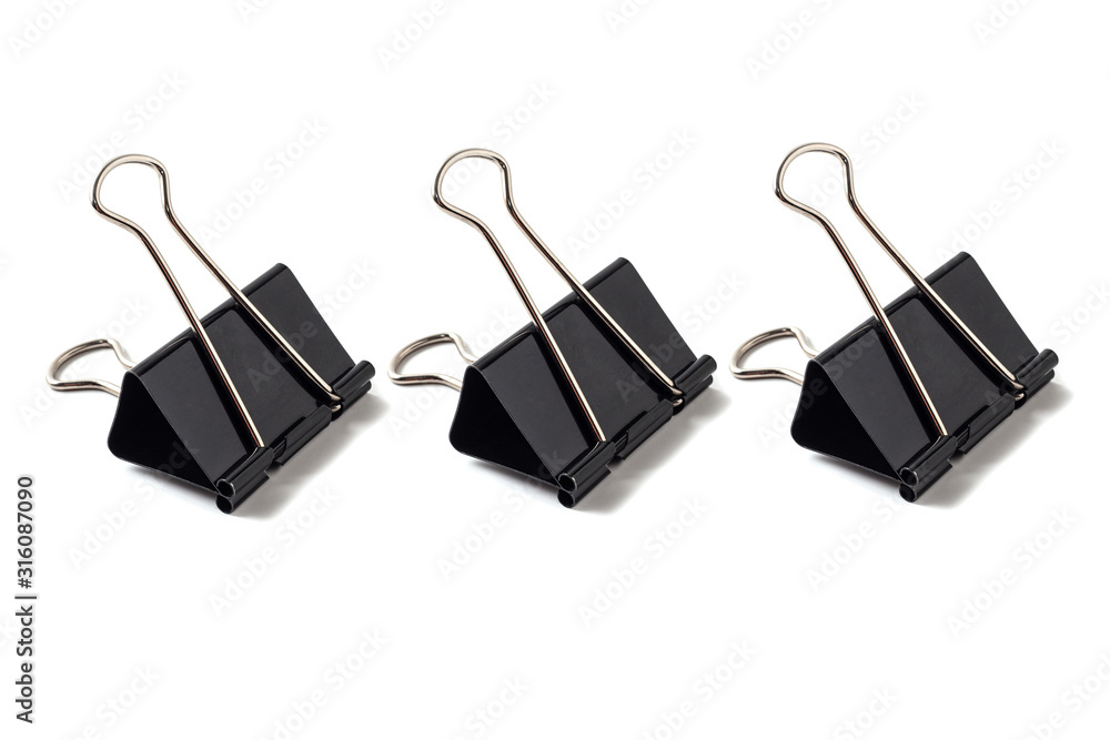 Black metal binder clips on white background isolated. Office paper clips  tool for paper documents clamping. Stationery. foto de Stock | Adobe Stock