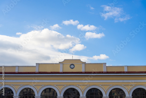 Old classy architecture building facade with arched doors against blue sky. Athens, Monastiraki station.