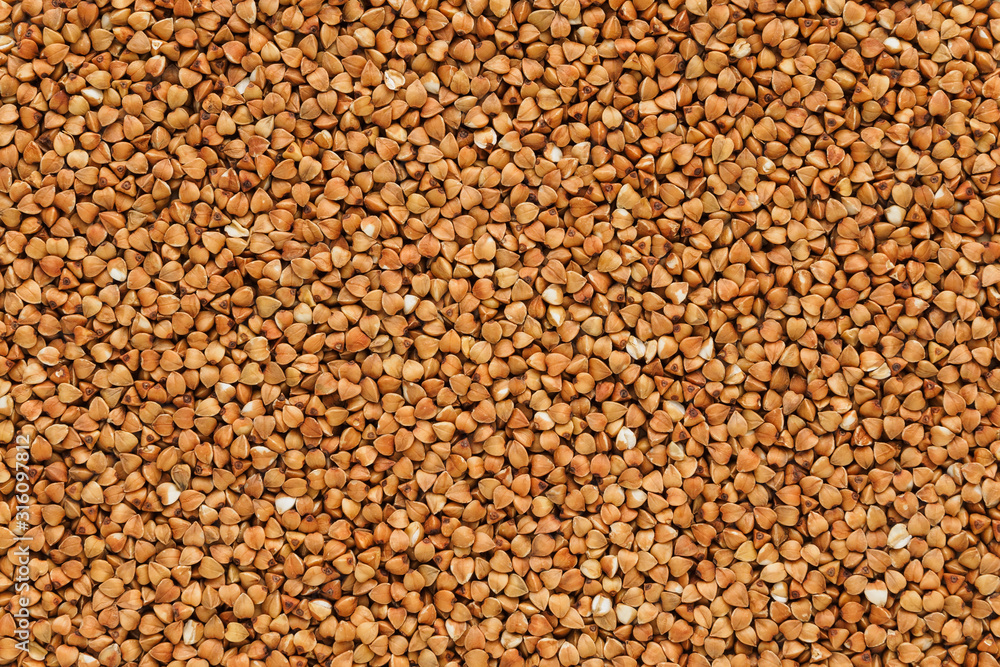 Buckwheat background. A lot of buckwheat in the form of texture Buckwheat background. A lot of buckwheat in the form of texture