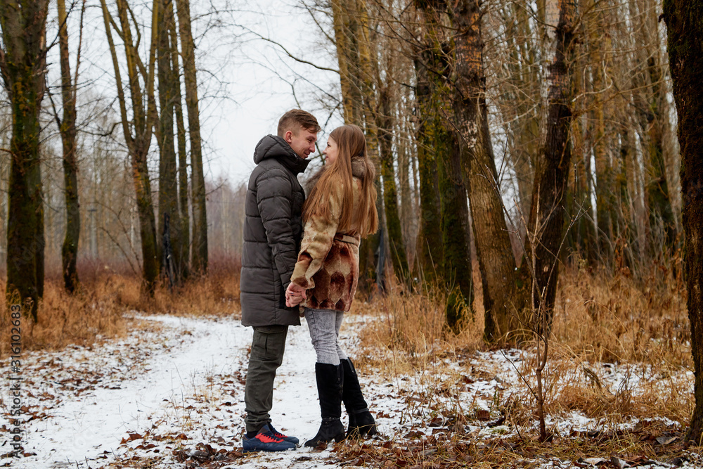 Romantic couple in love on autumn or winter walk Romantic couple in love on autumn or winter walk