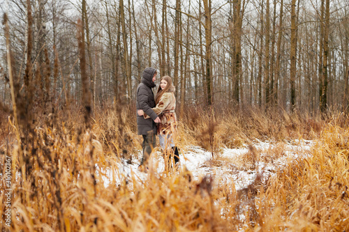 Romantic couple in love on autumn or winter walk