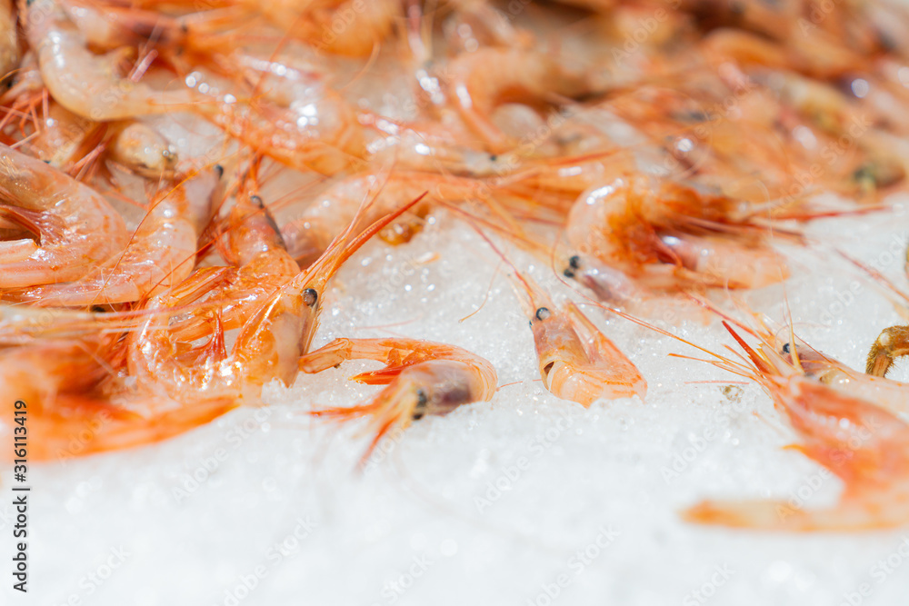 Fresh shrimp on ice at the fish market Fresh shrimp on ice at the fish market
