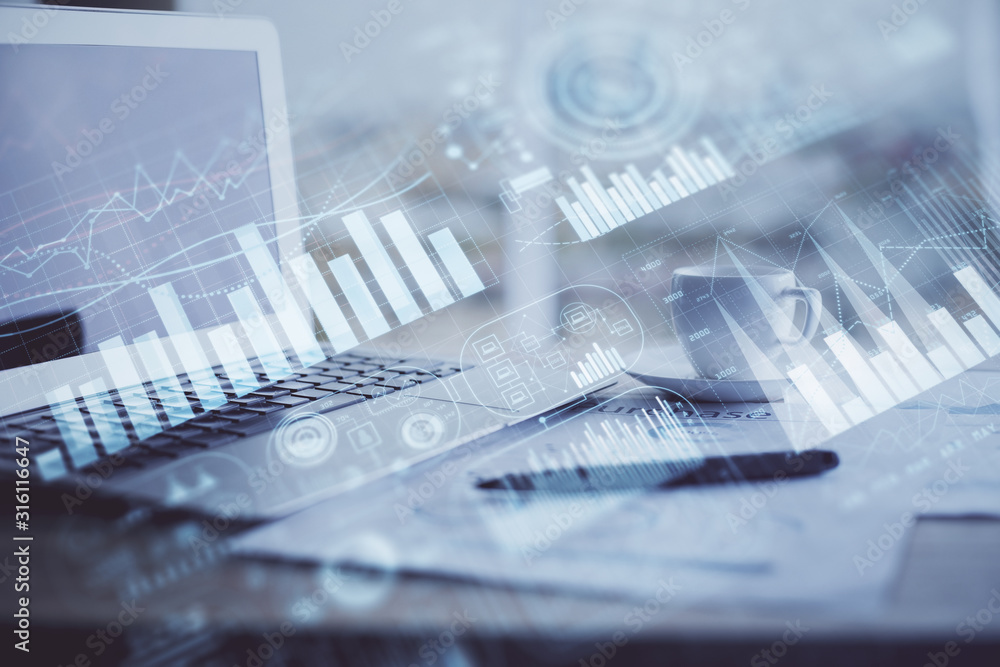 Forex graph hologram on table with computer background. Double exposure. Concept of financial markets.