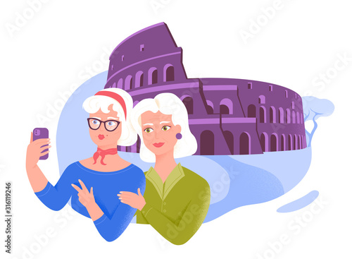 Two senior female friends taking selfie near the Coliseum. Active leisure and special offers for older people.