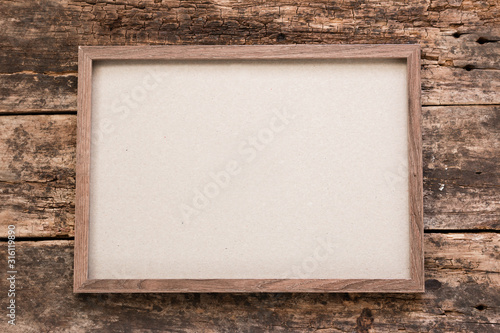 horizontal empty photo frame on wooden background mockup