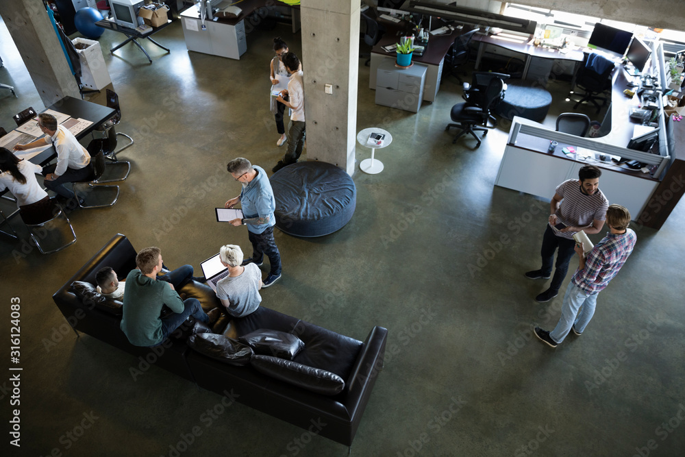 Overhead view business people talking in open plan office Stock Photo ...