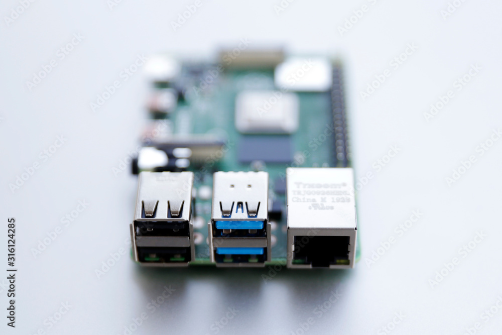 RJ45 and USB ports closeup on Raspberry Pi 4 board. The Raspberry Pi is a  credit-card-sized single-board computer. Photos | Adobe Stock