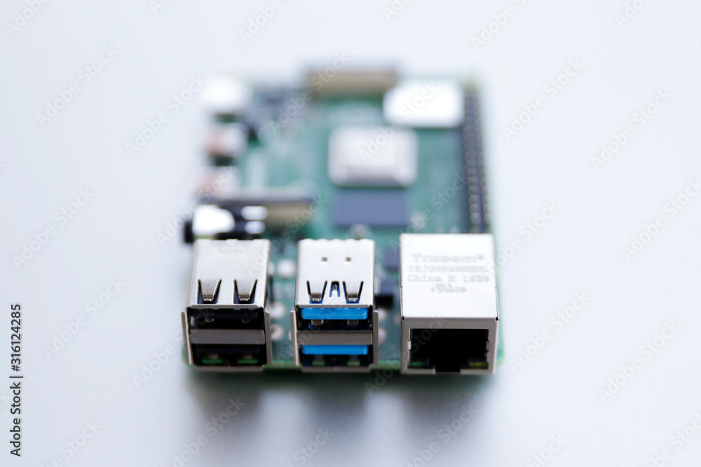 RJ45 and USB ports closeup on Raspberry Pi 4 board. The Raspberry Pi is a credit-card-sized single-board computer. RJ45 and USB ports closeup on Raspberry Pi 4 board. The Raspberry Pi is a credit-card-sized single-board computer.