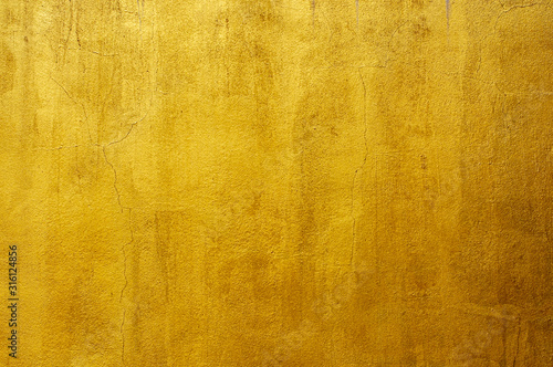Golden cement or concrete wall for texture background