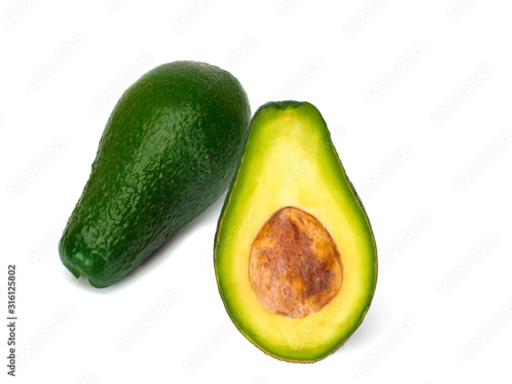 Avocado and avocado half isolated on a white background.