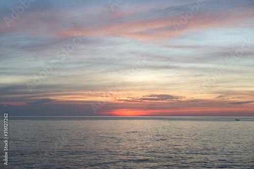 Sea pink sunset. Beautiful color clouds.