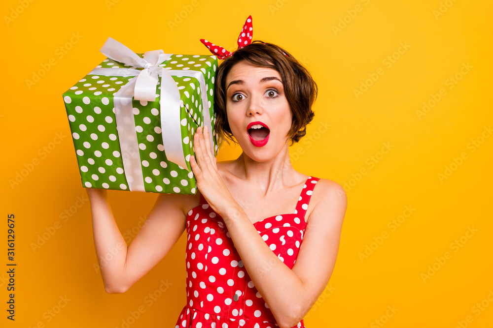 Portrait crazy astonished girl get big green dream gift box shake it want know what boyfriend give her 14-february wear vintage style clothing isolated yellow color background - obrazy, fototapety, plakaty 