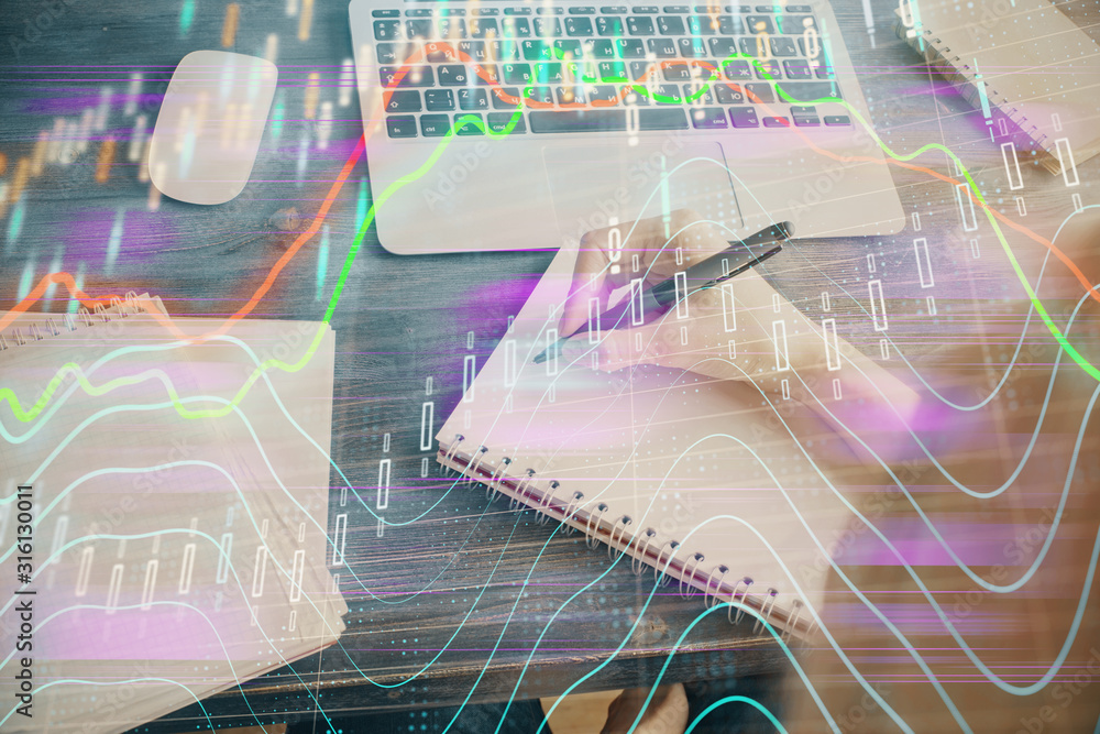 Financial graph displayed on woman's hand taking notes background. Concept of research. Multi exposure Financial graph displayed on woman's hand taking notes background. Concept of research. Multi exposure