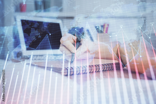 Financial graph displayed on woman's hand taking notes background. Concept of research. Double exposure