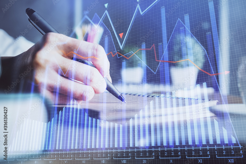 Financial forex charts displayed on woman's hand taking notes background. Concept of research. Double exposure Financial forex charts displayed on woman's hand taking notes background. Concept of research. Double exposure