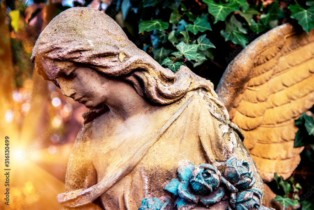 Abstract image of an angel figure in the rays of light. A symbol of hope, comfort, compassion and psychological help.