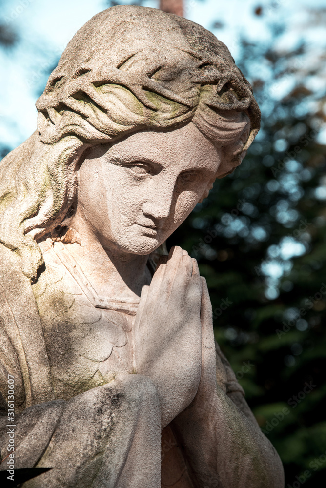 An abstract image of an angel praying for us and giving hope and help in desperate situations and suffering